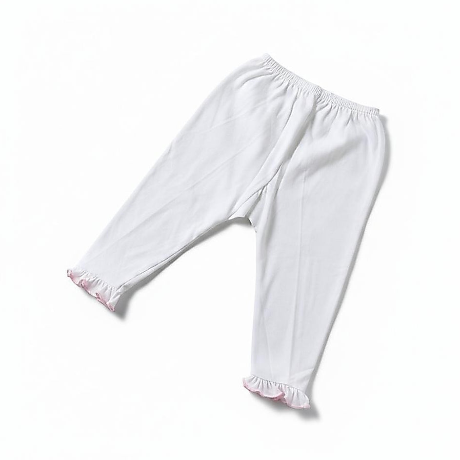 White children's leggings with an elastic waistband and ruffled hems, shown flat on a white background.