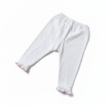 White children's leggings with an elastic waistband and ruffled hems, shown flat on a white background.